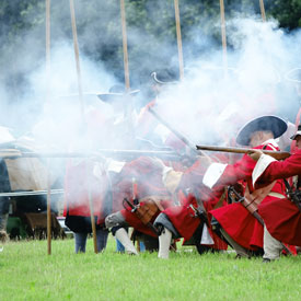 Red Coat Soldiers firing firelocks